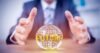 Businessman hands around a crystal ball with 'future' written on it